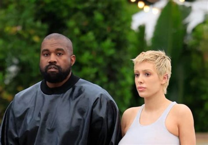 Kanye West Posts Racy Photo of Wife Bianca Censori Wearing a Swimsuit & Face Mask in the Kitchen