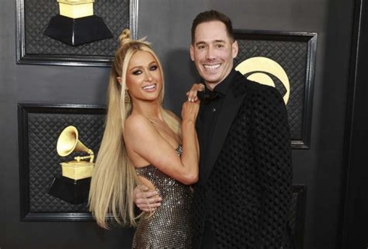Paris Hilton Trolled For Wearing A Diamond, Mesh Face Covering On Date Night With BF Carter Reum — See Pic